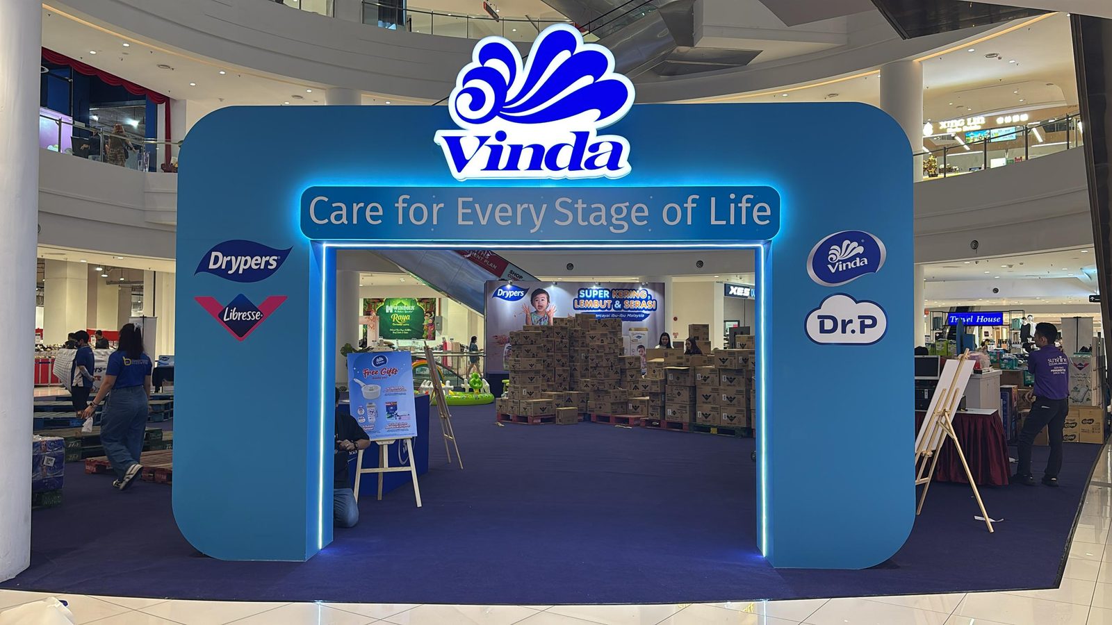 Vinda branded blue gateway archway at a shopping-mall retail activation